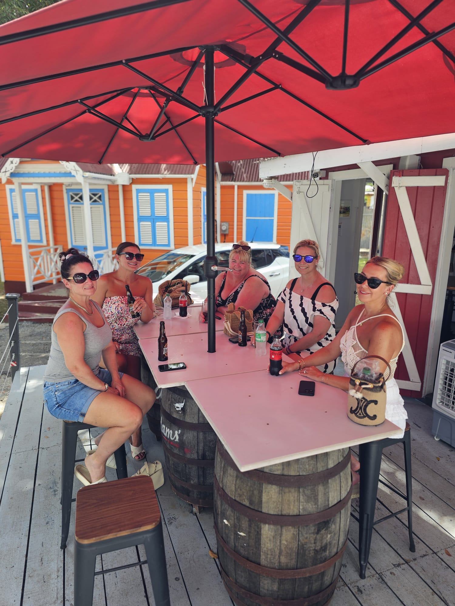 Tour group at a colourful Barbados rum shop on an island tour
