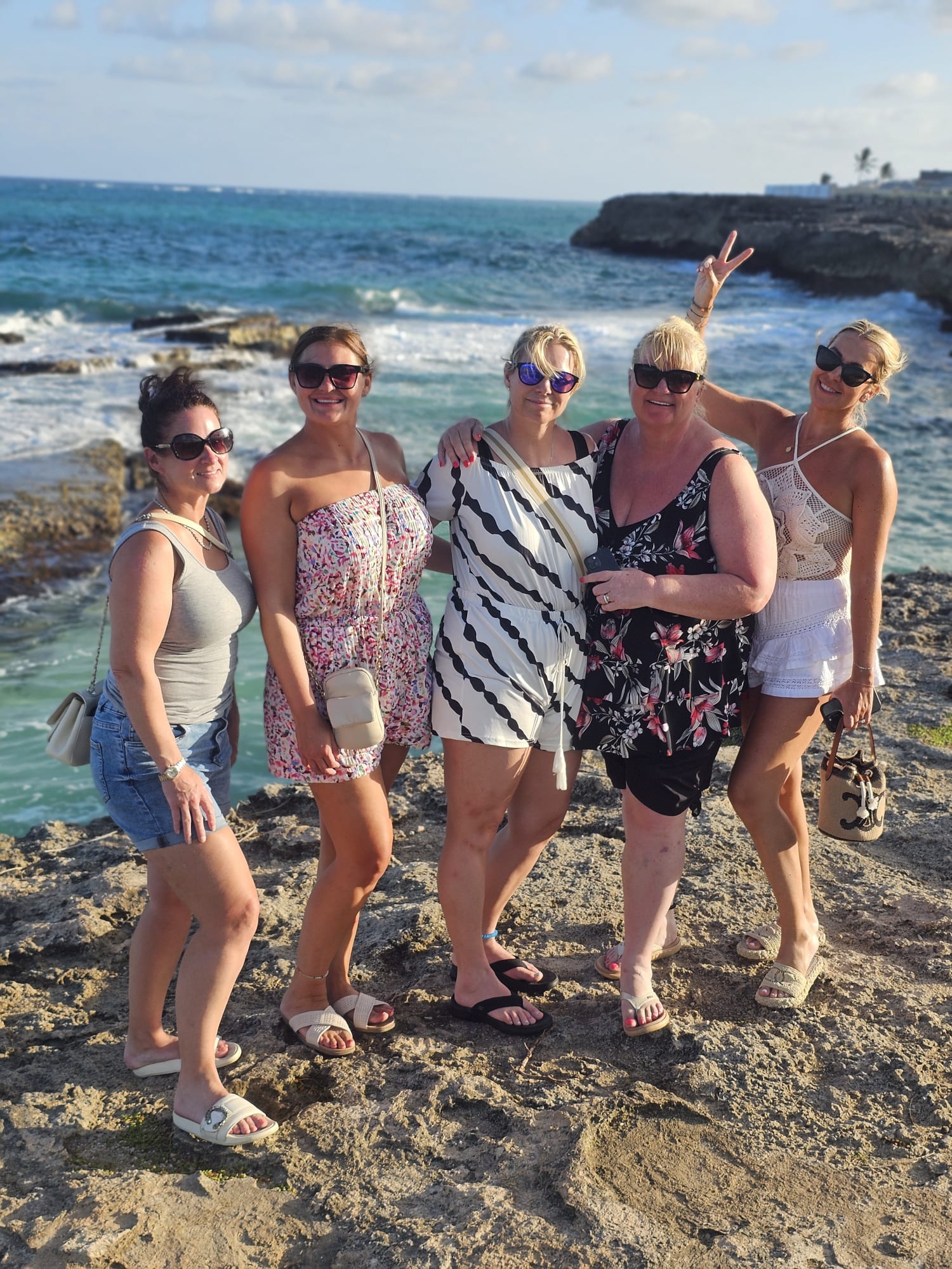Guests posing by the sea on a Barbados sightseeing tour