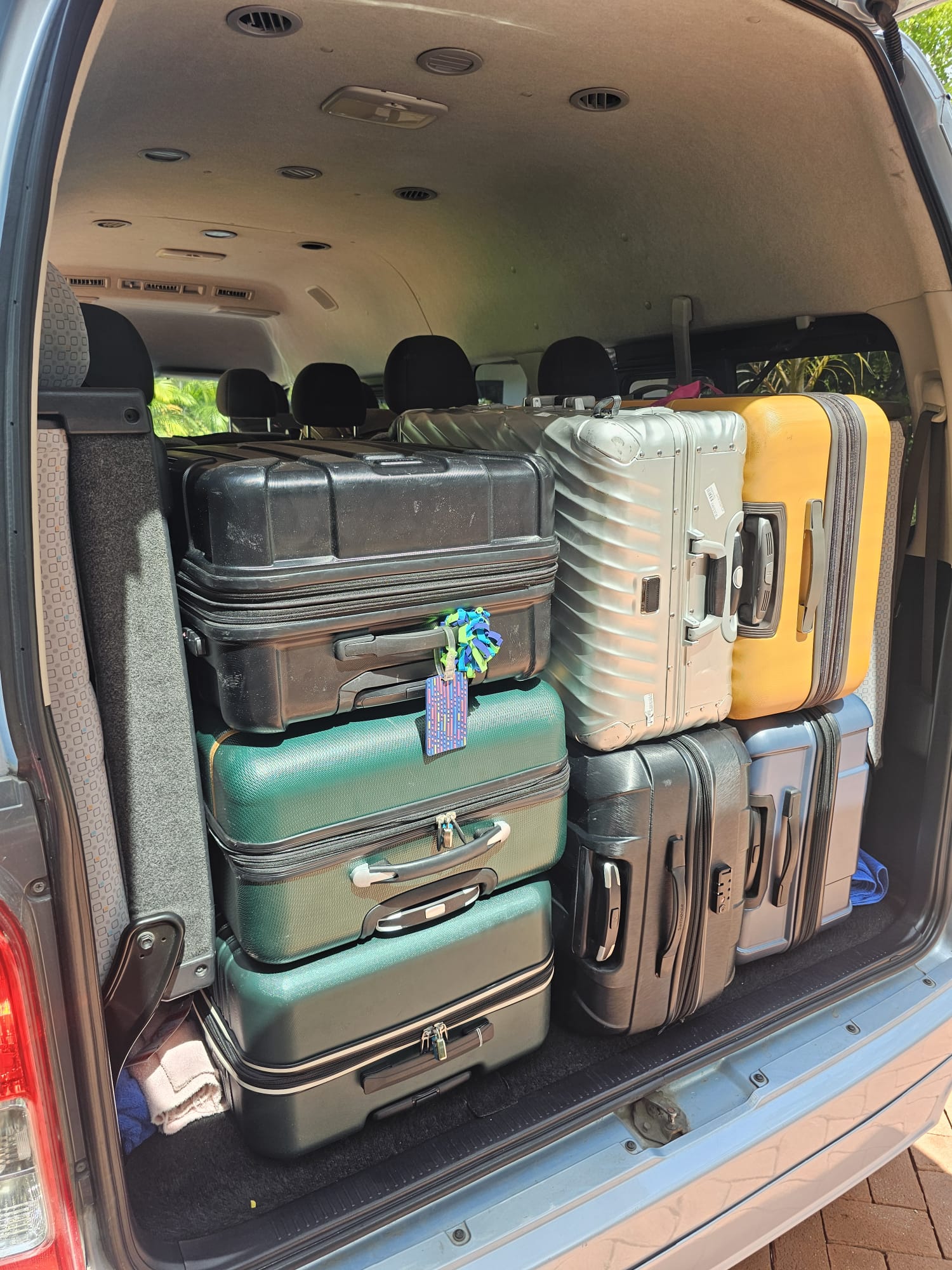 Suitcases packed in a Unique Chauffeurs van for an airport departure