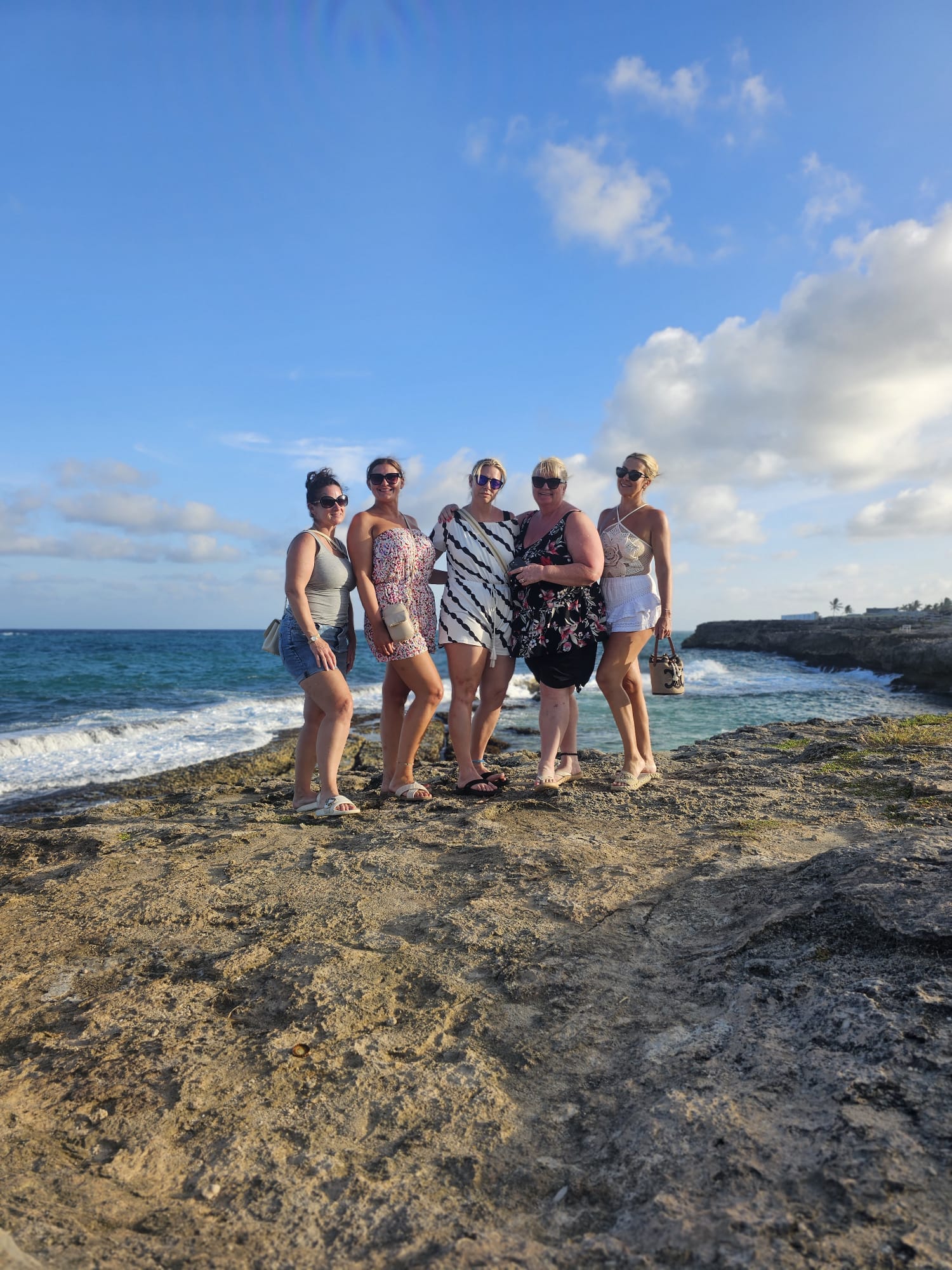 Friends enjoying a Barbados coastal viewpoint on a Unique Chauffeurs island tour