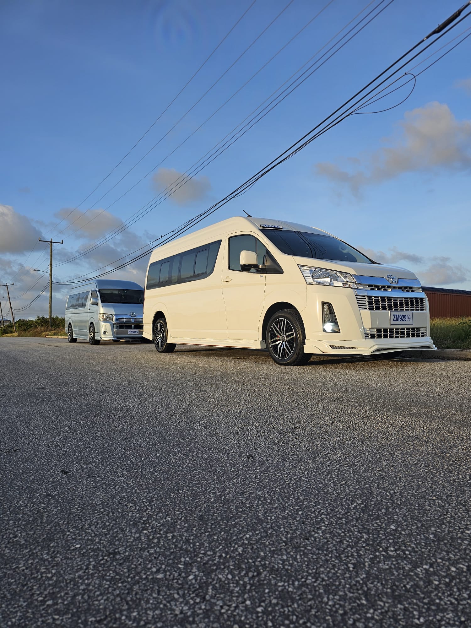 Two Unique Chauffeurs luxury vans on a Barbados airport transfer run