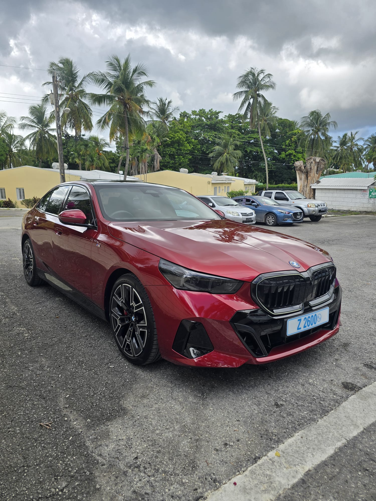 Red BMW luxury sedan in the Unique Chauffeurs Barbados fleet